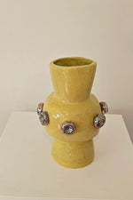 Buttons on Yellow Vase